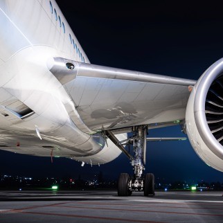 Jet engine of a stationary aircraft on the runway at night.